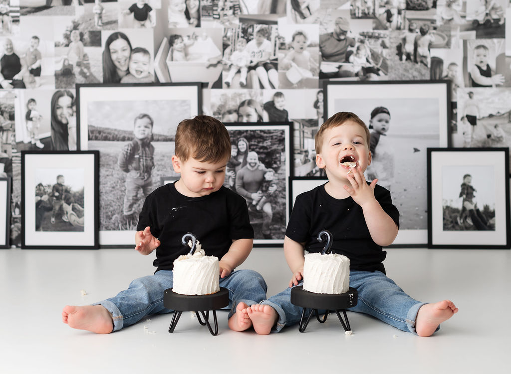 twin boy eating cake