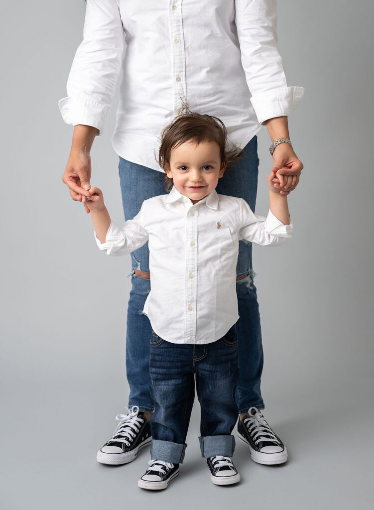 holding hands during motherhood photo session