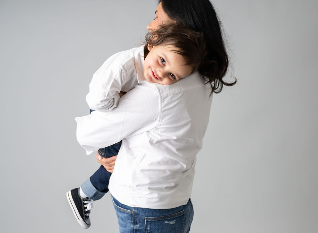 baby boy hugging mom